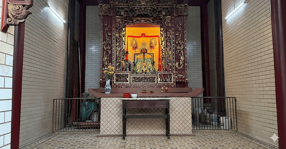 Statues of Guan Gong adorned in vibrant ceremonial robes